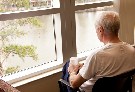 Patient in a hospital enjoying the view in a waiting room.