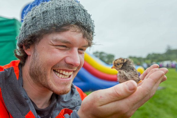 PIC BY @DAXON / CATERS NEWS - (PICTURED: Allan Dixon takes selfie with chick) This real-life Dr. Dolittle walks with the animals, talks with the animals, and... TAKES SELFIES with them. Traveller Allan Dixon has amassed a hilarious collection of shots with a variety of exotic creatures. Included in the 29-year-olds collection are smiling snaps with the likes of kangaroos, quokkas, camels and sea lions. In some of the shots, Allan, who is originally from Wicklow, Ireland, can even be seen in festive poses, placing a Santa hat on himself or his furry friends. - SEE CATERS COPY