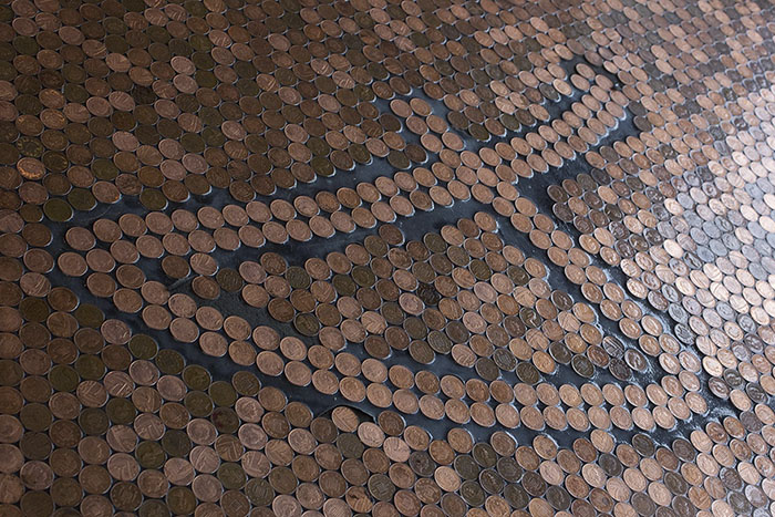 The penny floor at the barber shop BS4,  Lower Gornal, Dudley, West Midlands.  See NTI story NTIPENNIES.  A new barber shop has a very unique feature - a floor made out of 70,000 pennies.  The eye-catching floor at BS4 in Dudley, West Midlands, took three-and-a-half months to make.  Brett Davies, who has been in the business for 26 years, also has shops in Wordsley, Wombourne and Wall Heath but he said this was the "most extravagant" of the four.